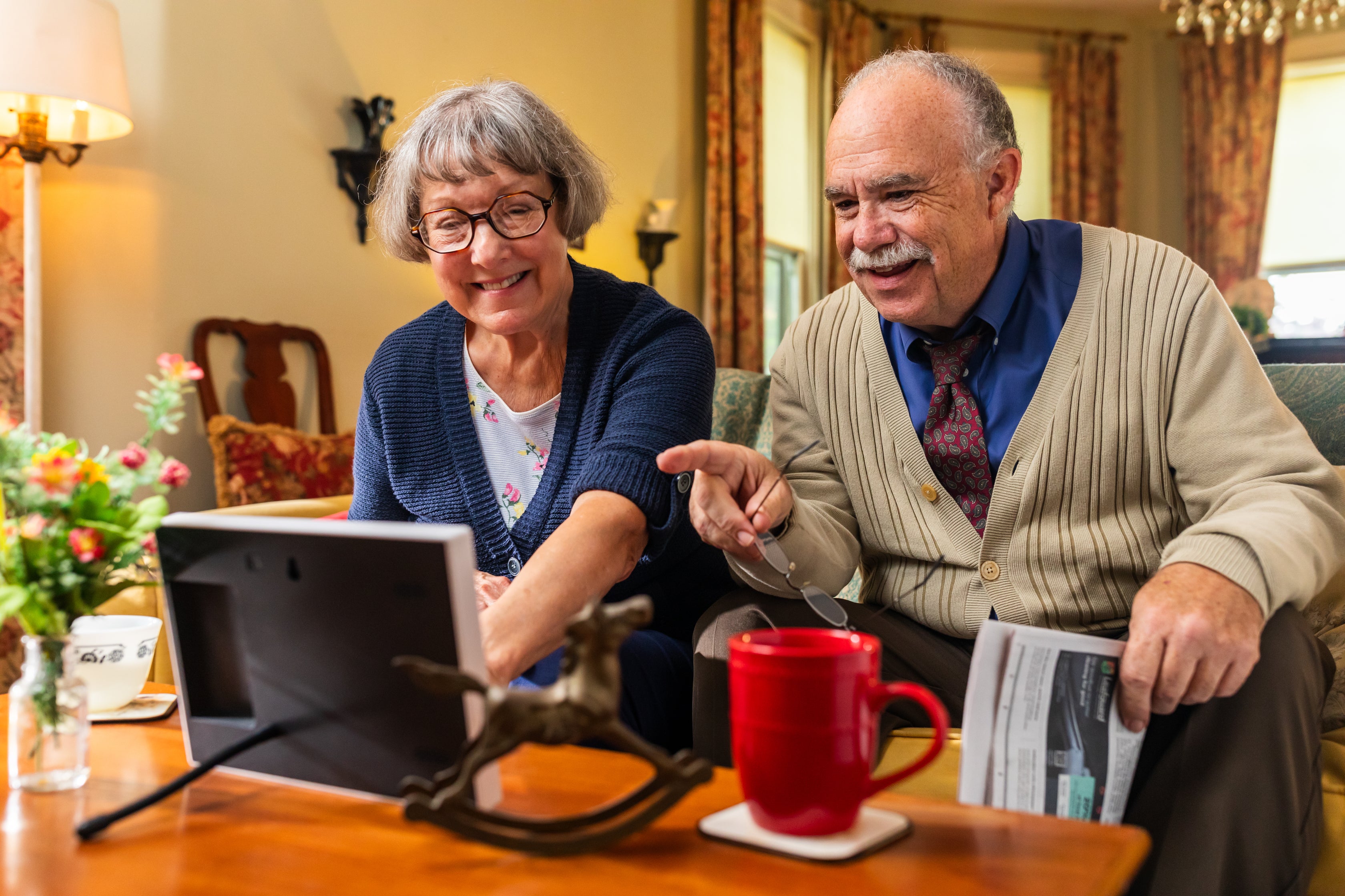 grandparents looking at smart frame