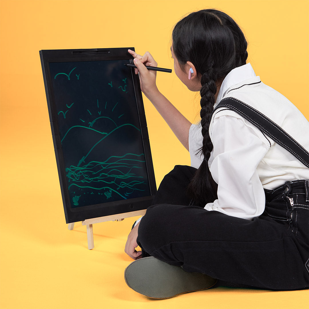 Child drawing on large 21-inch LCD writing board for kids with stylus and easel stand
