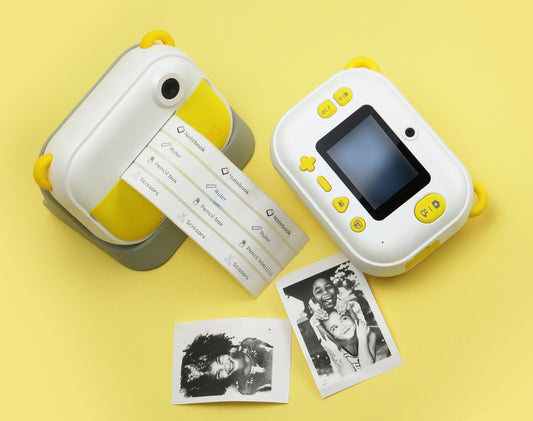 myFirst Camera Insta Wi printing classroom labels and instant photo stickers for teachers and kids on a yellow background