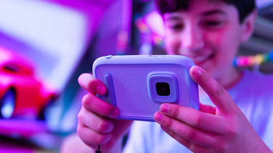Child using the myFirst Camera 50 kids digital camera in purple, designed with safe AI video features