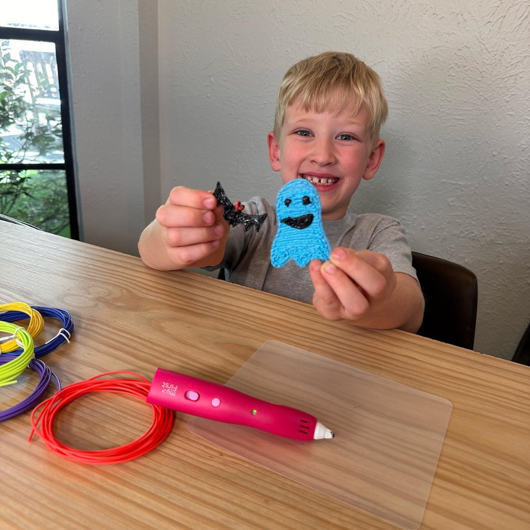 Toddler with 3D Pen arts and crafts creation