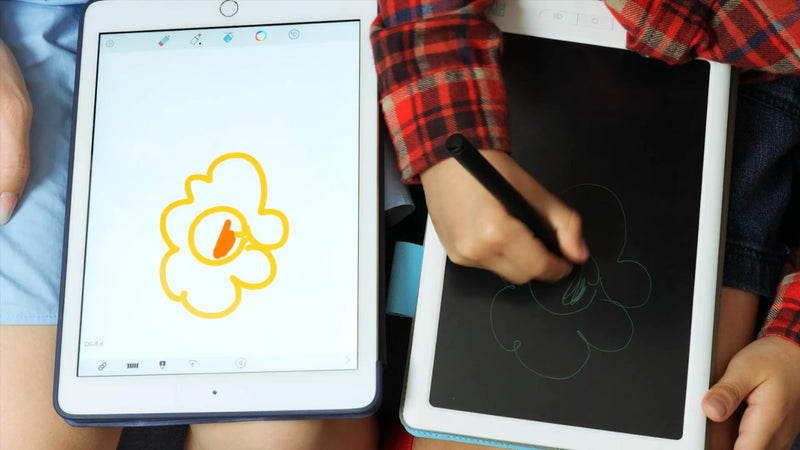 A kid is drawing with a drawing pad for kids.